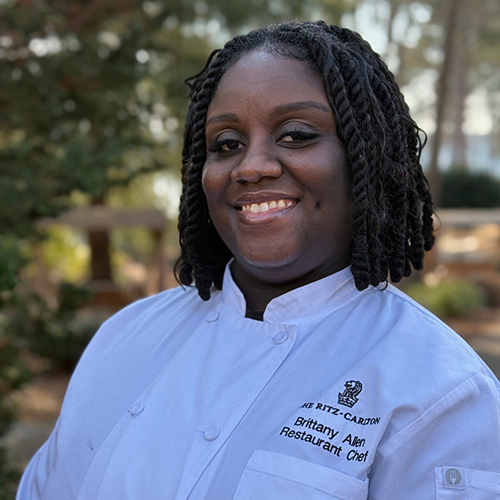 Ritz-Carlton chef Brittany Allen smiles for her headshot.