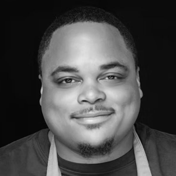 Chef Robert Butts headshot in black and white.